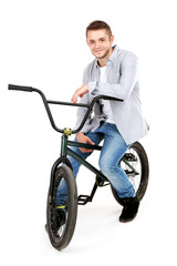 Obraz premium Young boy on BMX bike isolated on white