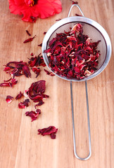 Hibiscus dried tea on wooden background