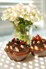 Tasty cupcakes on table, close up