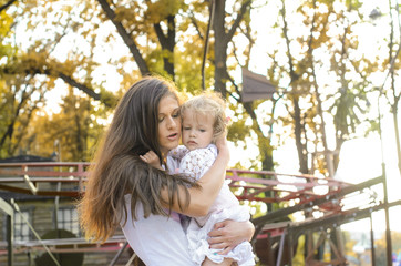 Fototapeta premium Mom and her little daughter walking