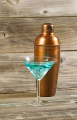 Mixed drink and Metal Mixer on Rustic Wood