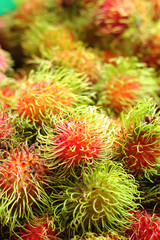 Sweet fruits rambutan in the market