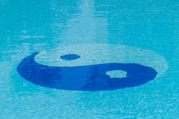 Yin Yang symbol in the pool.