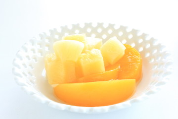 Fototapeta na wymiar Peach and pineapple for gourmet dessert