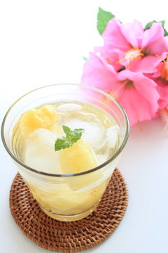 Pineapple sode with flower for tropical drink image