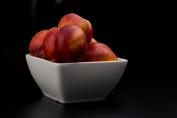 Nectarine friut on black isolated background