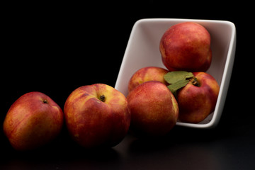 Nectarine friut on black isolated background