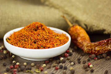 Saffron in saucer with pepper and chili