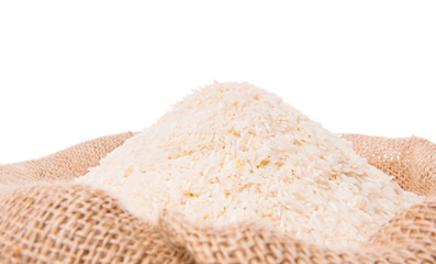 Rice in a gunny sack over white background