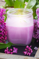 Obraz na płótnie Canvas fresh lilac flowers spa setting