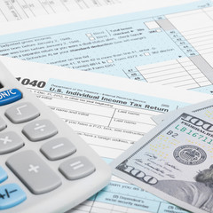 Fototapeta premium US Tax Form 1040 with calculator and US do - 1 to 1 ratio