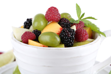 Fruit salad in cup on napkin isolated on white