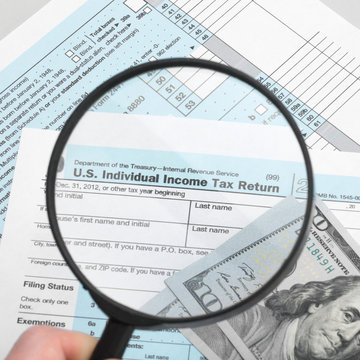 US Tax Form 1040 with magnifying glass - 1 to 1 ratio