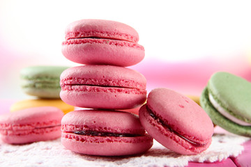 Gentle macaroons on table on light background