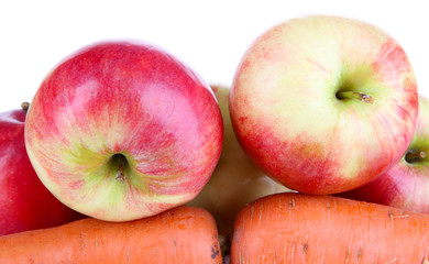 Sweet apples and carrots isolated on white