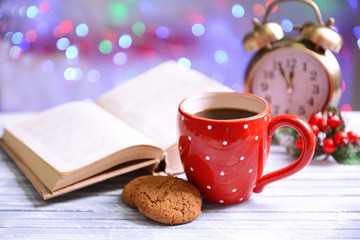 Composition of book with cup of coffee