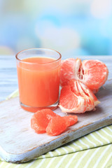 Ripe grapefruits and fresh juice