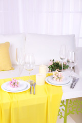 Festive table setting in interior
