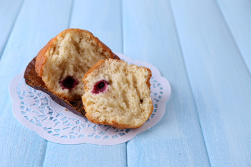 Blueberry muffin on color wooden background