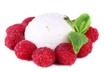 Creamy ice cream with raspberries and mint leaves isolated