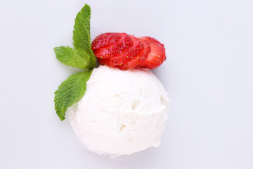 Creamy ice cream with strawberry and mint leaves isolated
