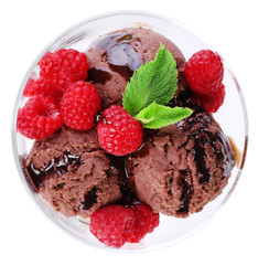 Chocolate ice cream with mint leaf and raspberries in glass