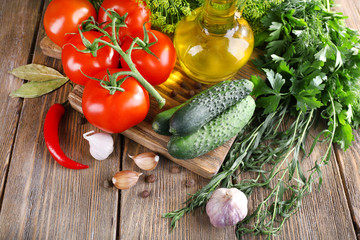 Fresh vegetables with herbs and spices on table, close-up