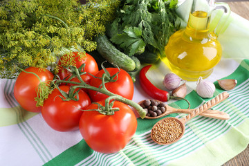 Fresh vegetables with herbs and spices on table, close-up
