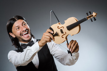 Fototapeta na wymiar Funny fiddle violin player in musical concept