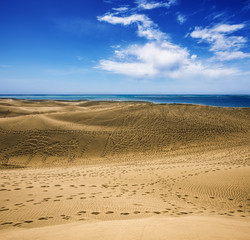 beach with marks - footprints in sand dunes