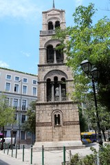 Fototapeta na wymiar The bell tower in front of the church Sotira Lykodimou