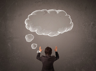Businessman with cloud thought above his head