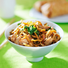 chinese chicken lo mein in a bowl