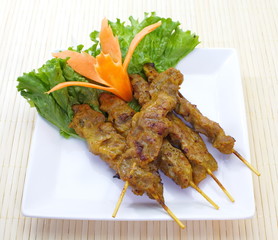 Grilled Pork Satay with fresh vegetable on white background