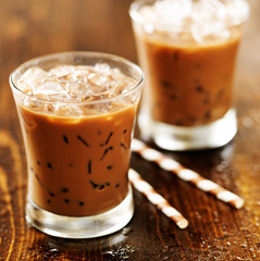 two glasses of iced coffee shot with selective foc us