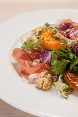 Hot salad with vegetables and nuts