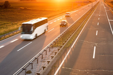 White bus in motion blur on highway