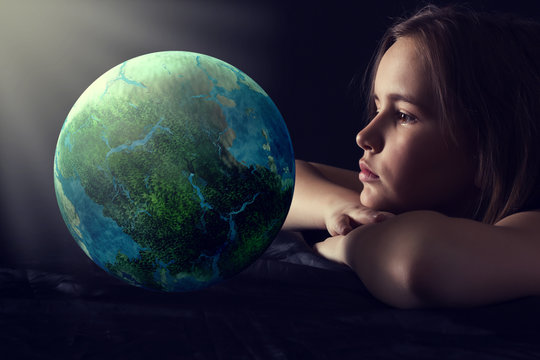 Teen girl with planet earth.