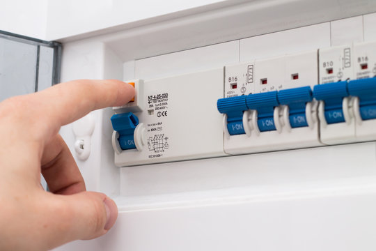 Man testing the fuse box
