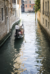 Fototapeta na wymiar Man on a boat in Venice