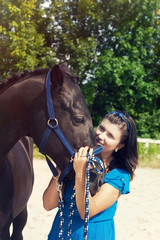 girl embraces a horse