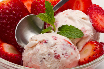 Strawberry ice cream with fruits close up