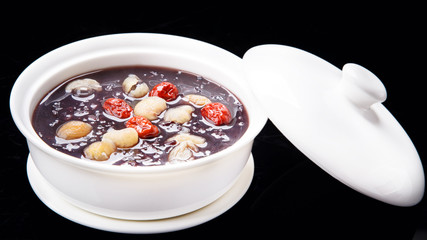 black sticky rice sweet soup. isolated on black