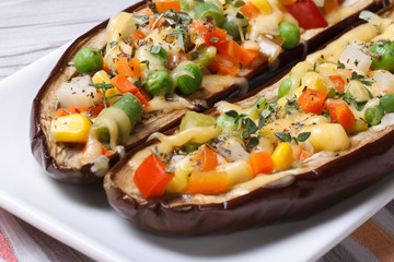 Half baked eggplants stuffed with vegetables and cheese