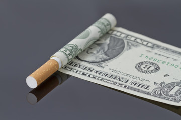 Cigarette which instead of tissue paper dollar.