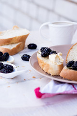 summer snack on french baguette on a wooden board