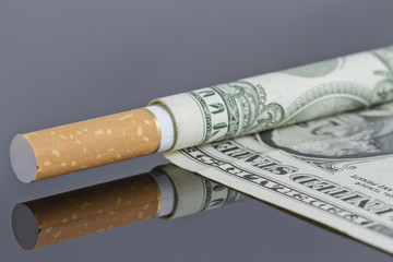 Cigarette which instead of tissue paper dollar.