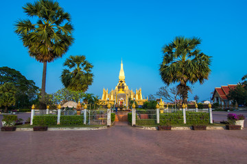 Naklejka premium King Setthathirat statue and Pha That Luang stupa