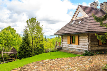 Fototapeta na wymiar Beautiful log cabin in forest