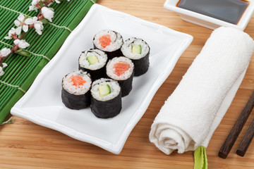Sushi maki set with fresh sakura branch